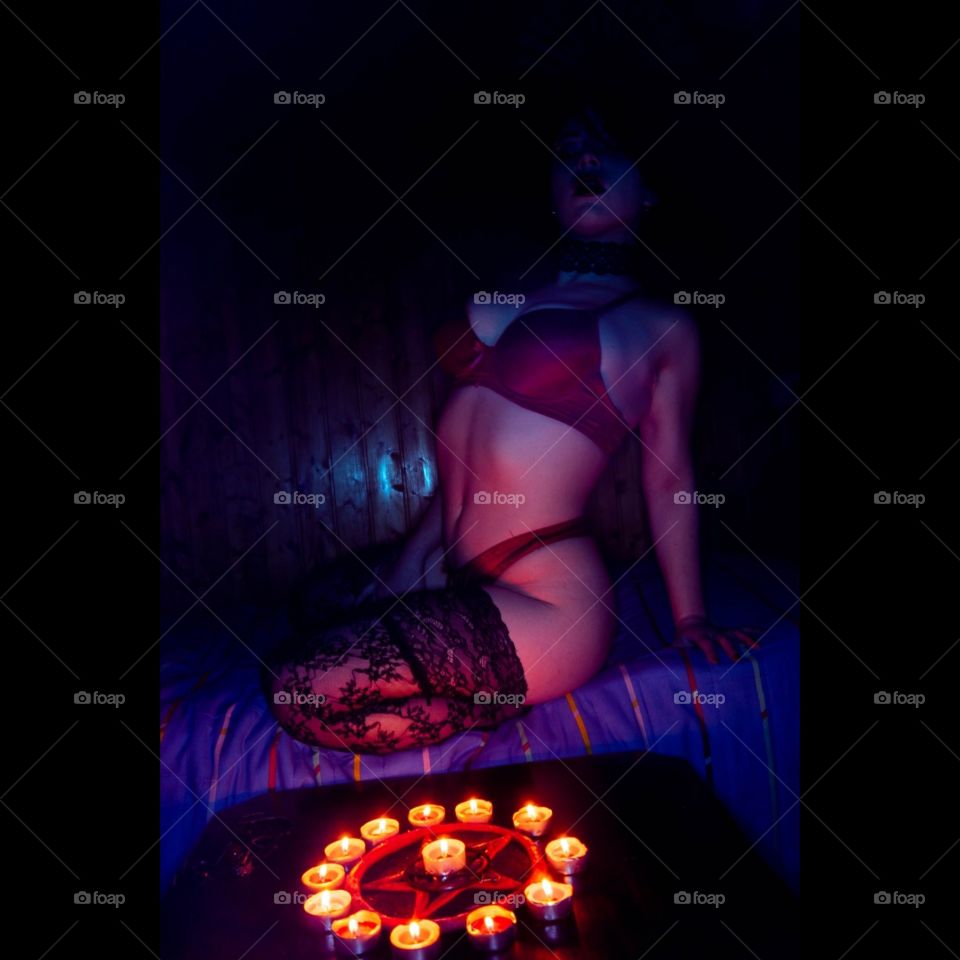 a professional photo of a set of mine.
i'm wearing Red lingerie and High socks with candles in front of me.