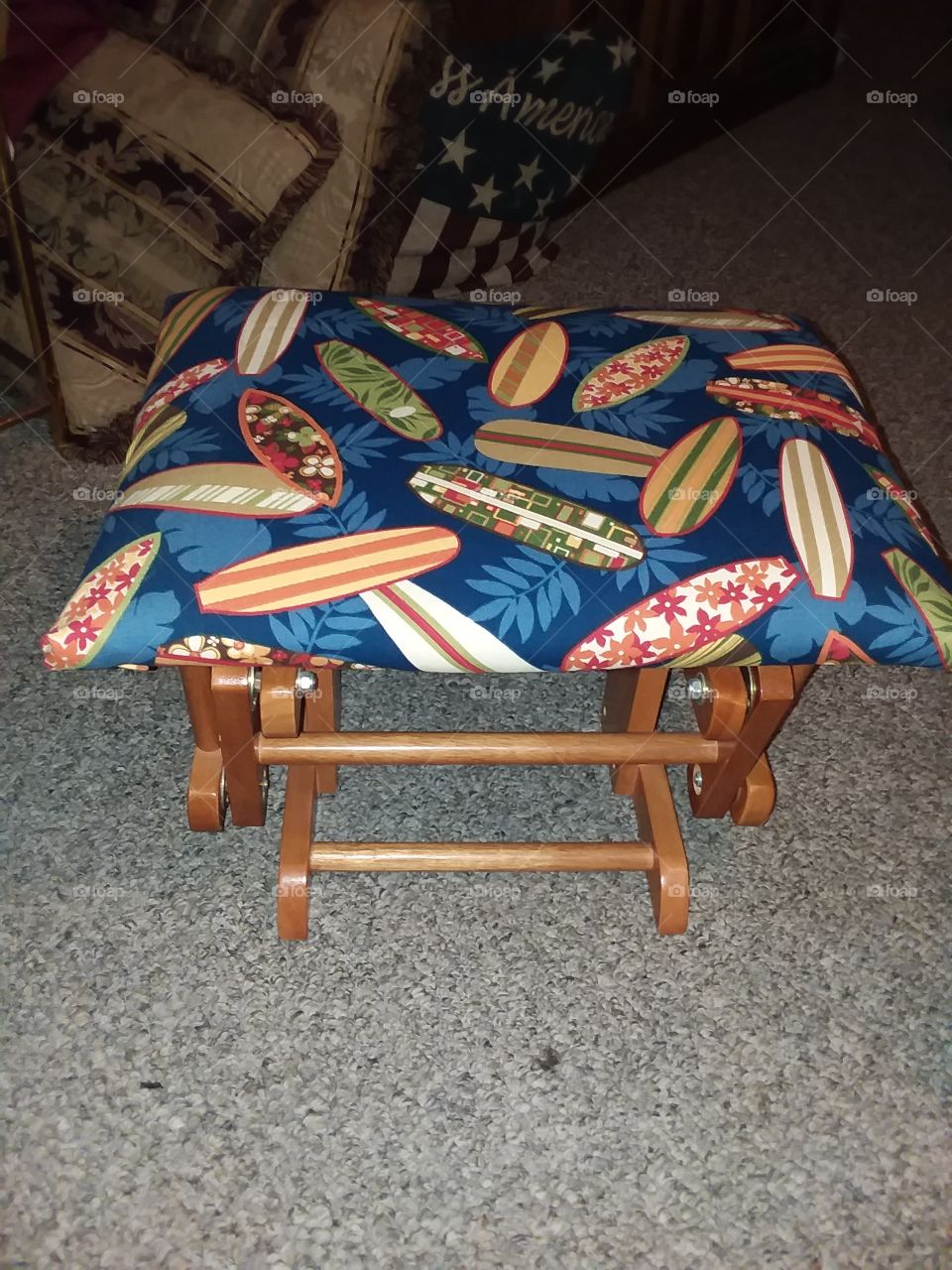 An antique ottoman I refinished and  recovered