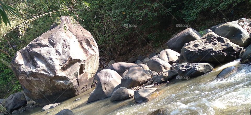 This big rock is in the middle of the river