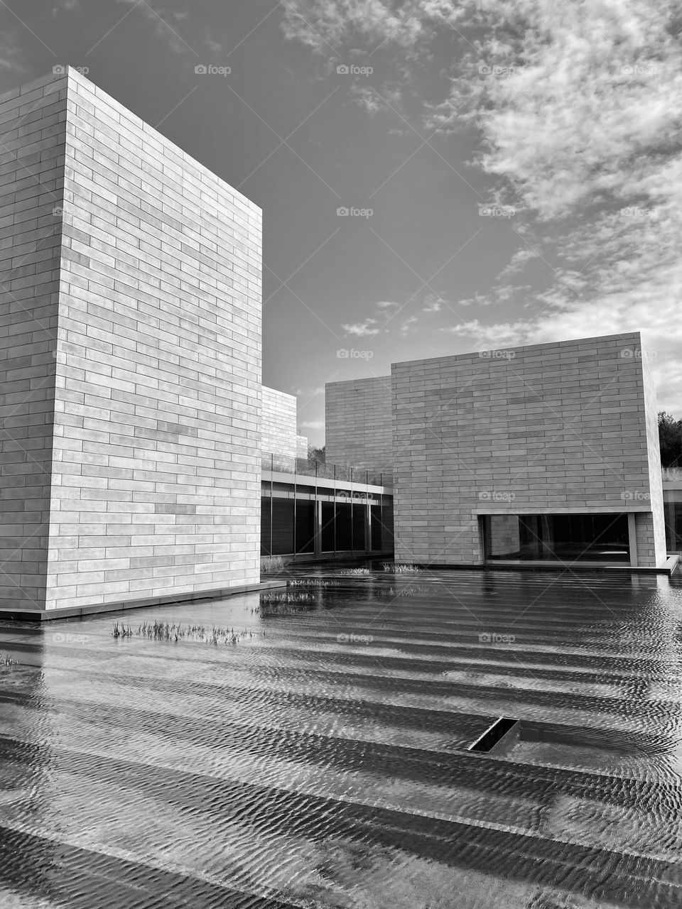 A water filled courtyard between some buildings