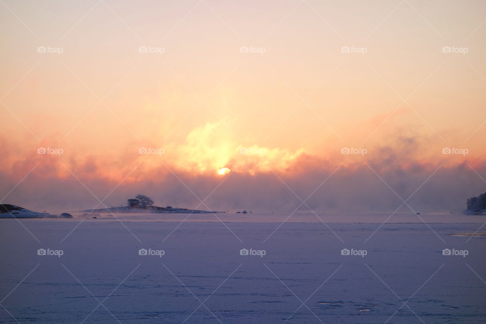 Winter sunrise by the freshly frozen Baltic Sea in Helsinki, Finland.