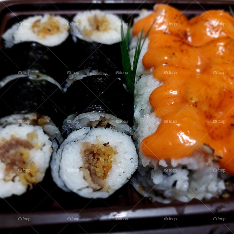 assorted sushi served in a container
