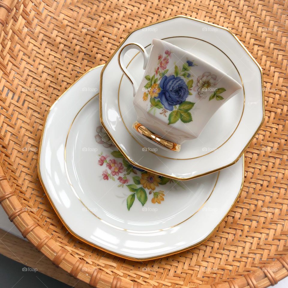 Old porcelain cup saucer plate with flower ornament