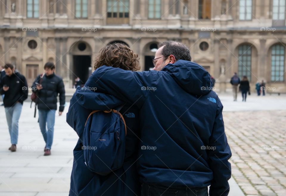 Father and son, holding each other