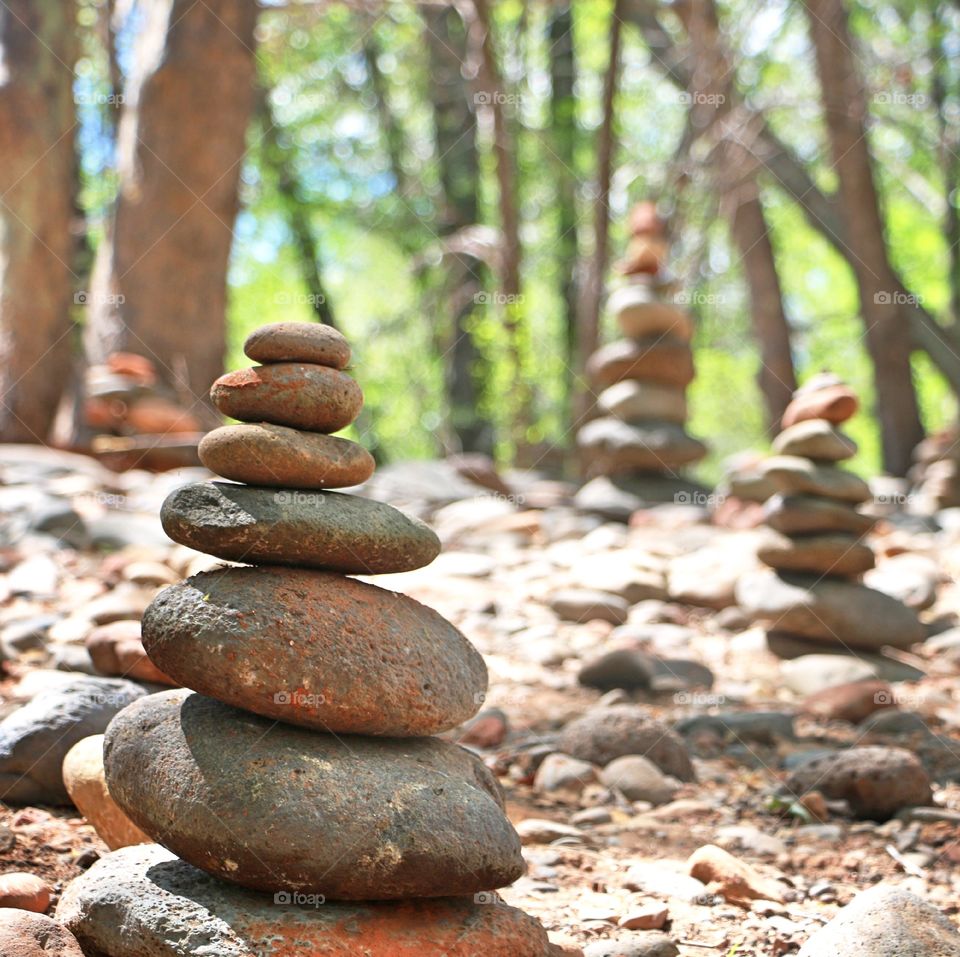 Stacking stones in forest