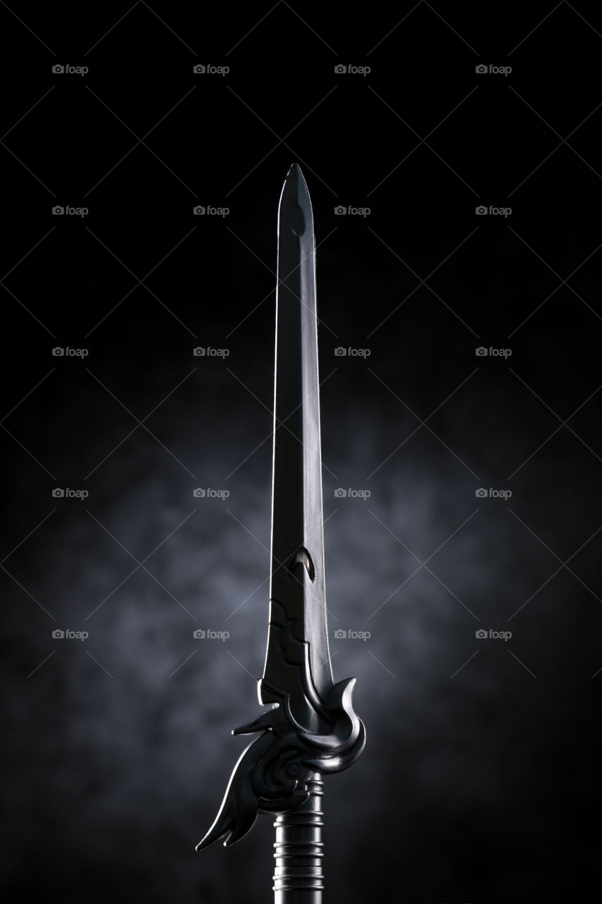 Sharp sword knife Dagger on textured background