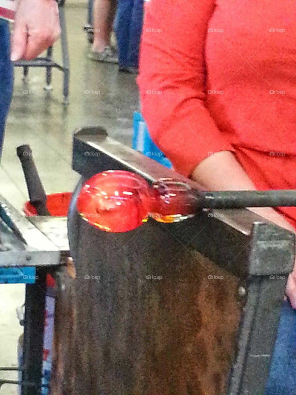 Shaping molten glass before blowing