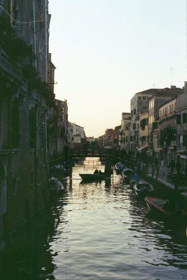 View of a Venitian canal at sunset