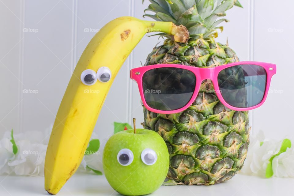 Fruit with funny eyes and glasses 