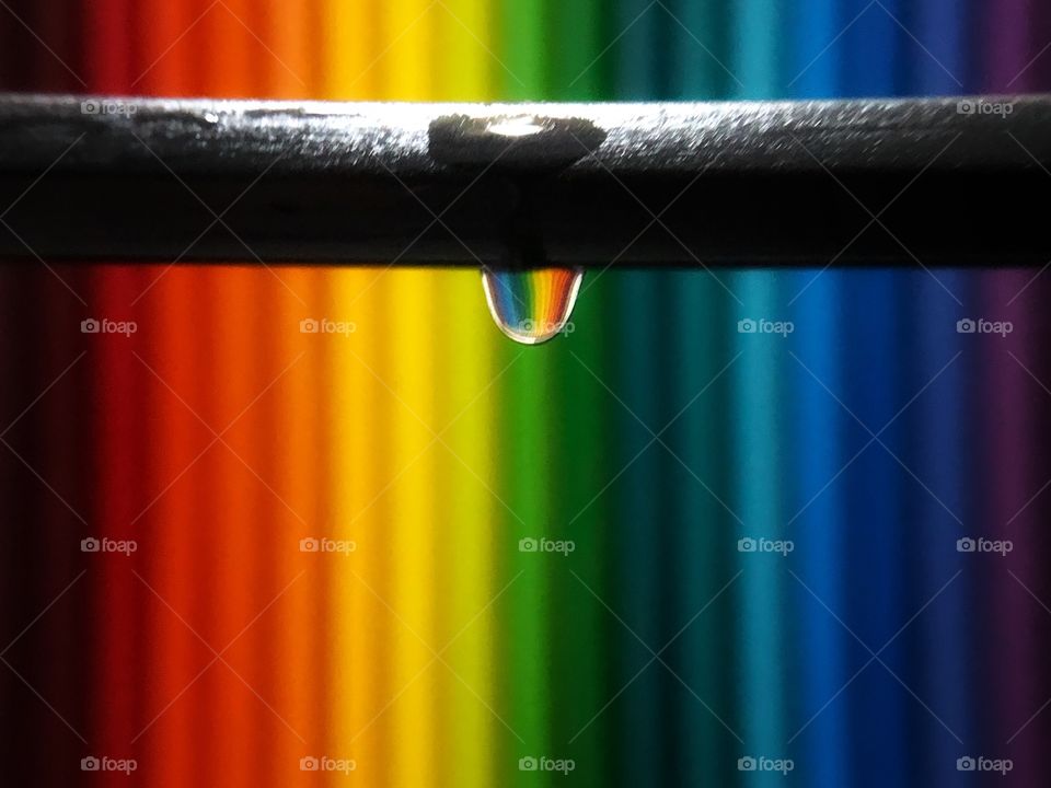 Rainbow in a water drop... colored pencils make a great background for a single drop falling...