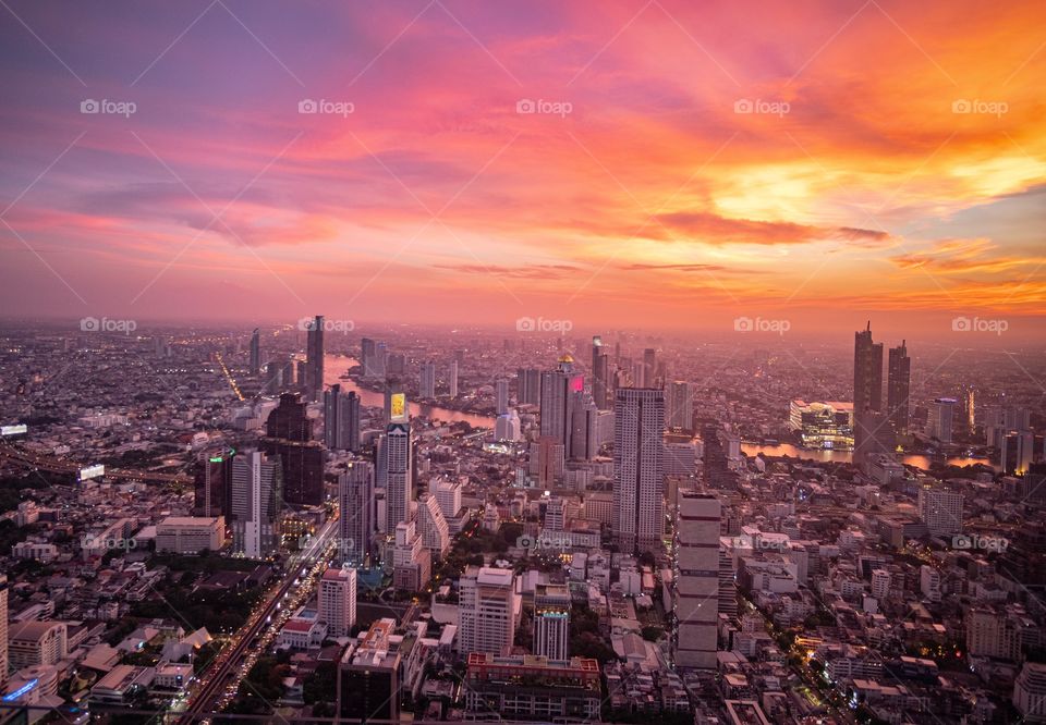 Bangkok/Thailand-May 04 2019:Twilight in the capital city from bird eyes view , Mahanakorn building roof top