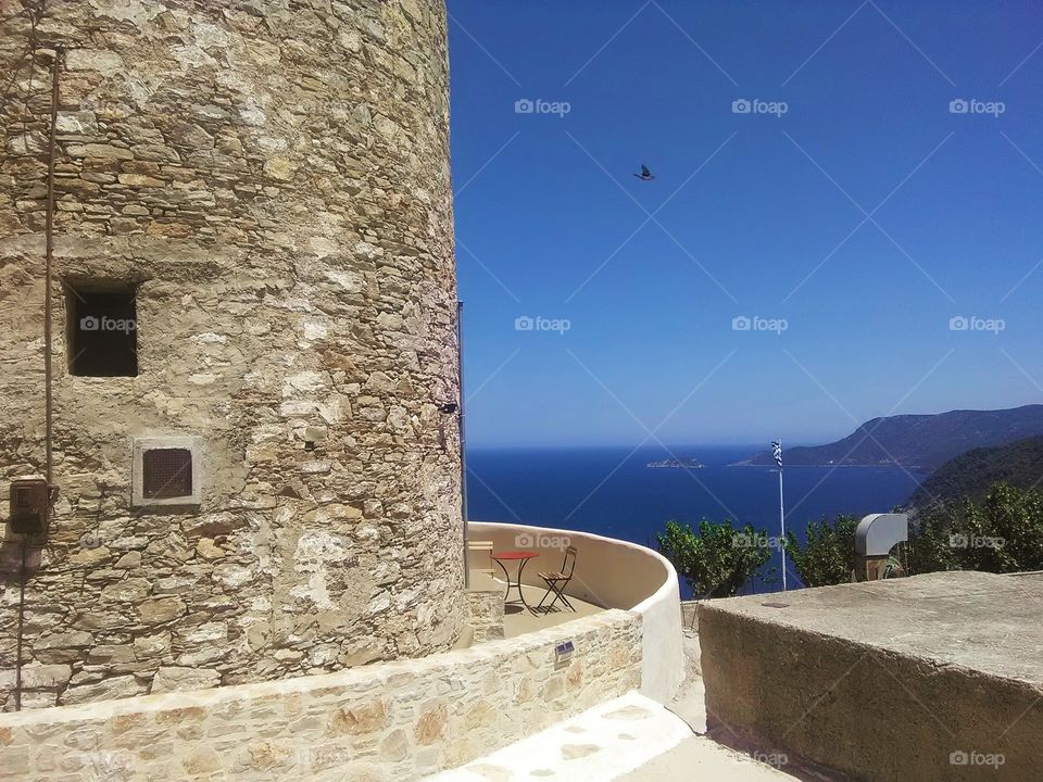Sea, tower and a bird, Greece