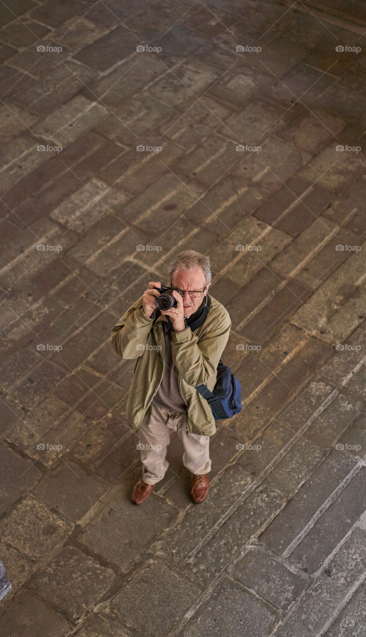 High angle view of man with camera