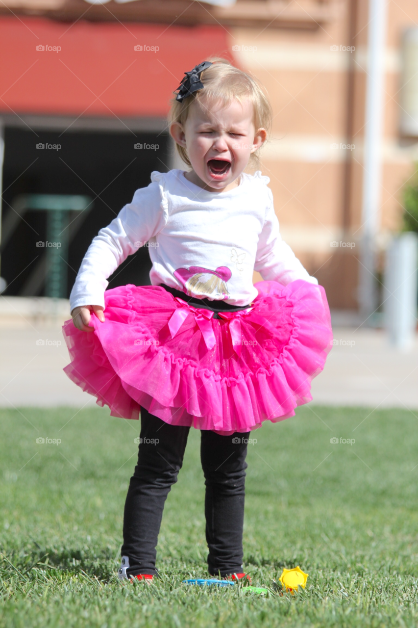 Little crying girl in park