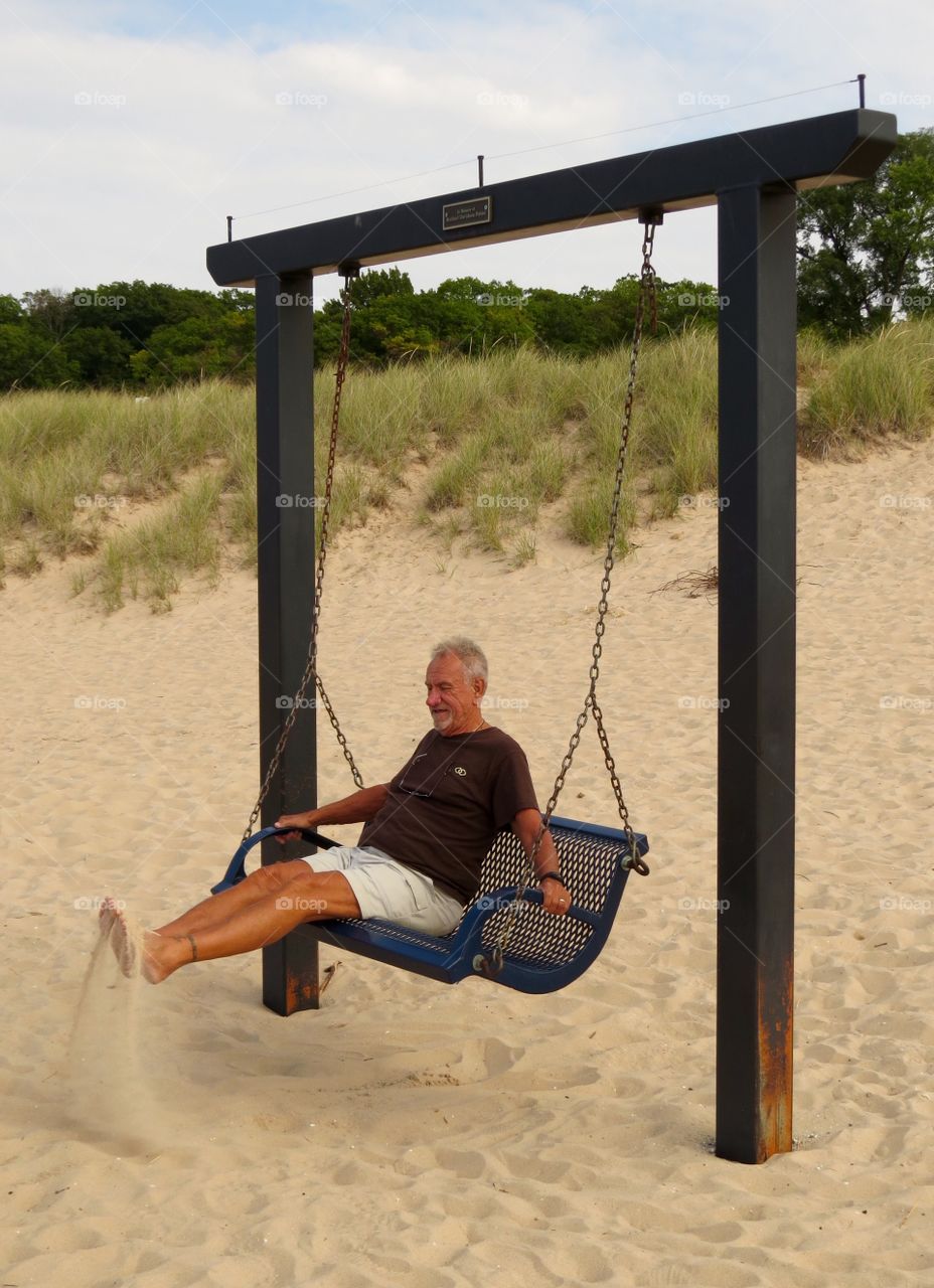 Man on a swing. Man on a swing, Frankfort MI