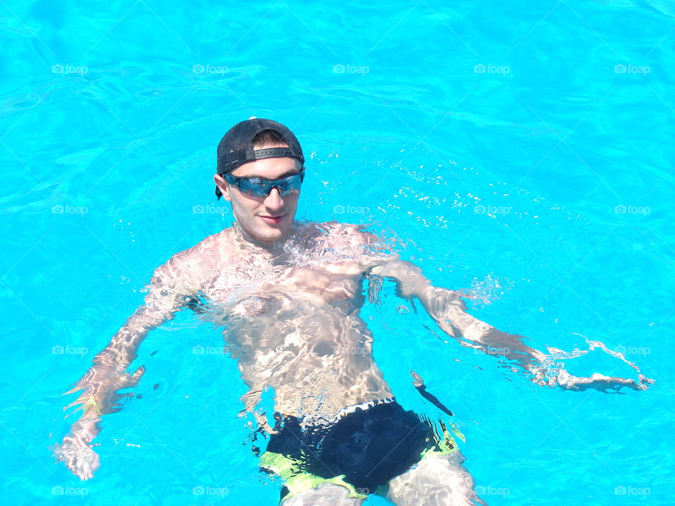 Man swimming in pool