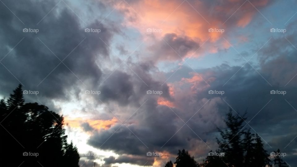 beautiful peaceful sunset with colors of pink, yellow, grey, and blue, Dusk, summer evening