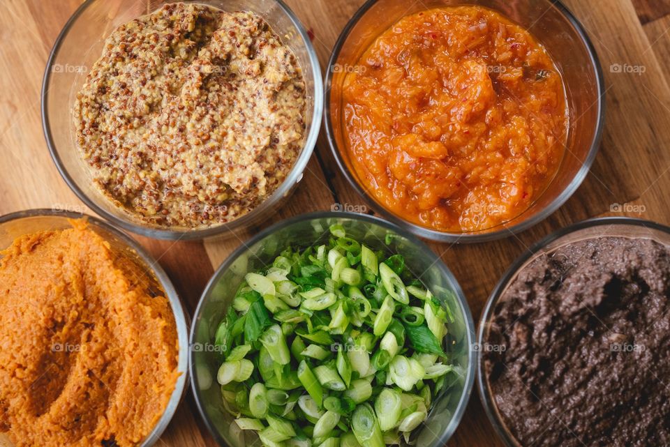 Beautiful orange, green, and browns,  culinary condiments 