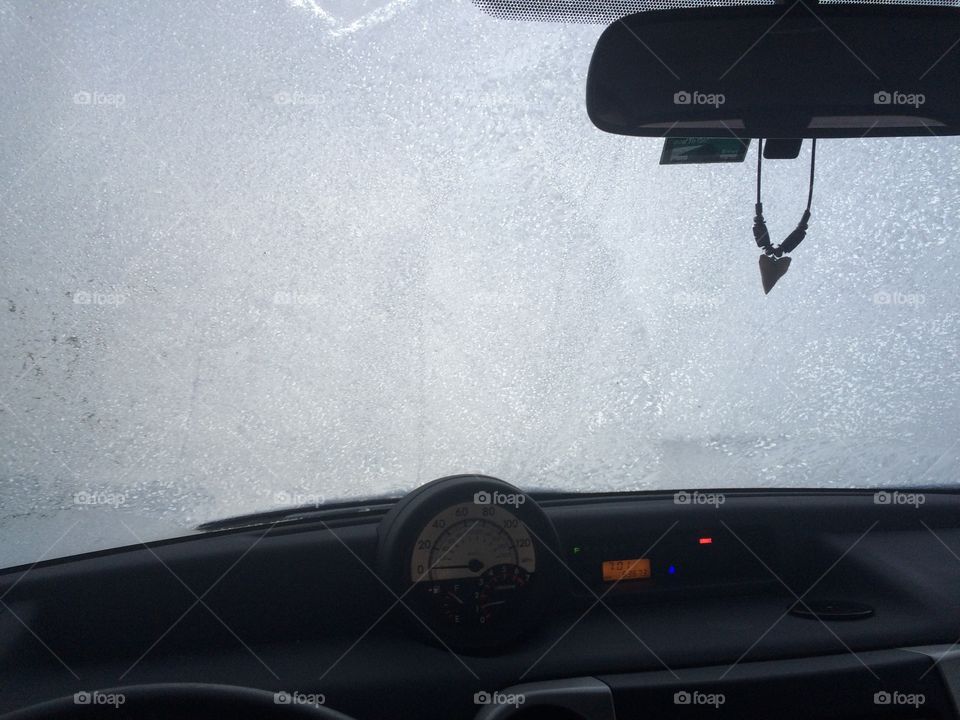 A frozen windshield during winter