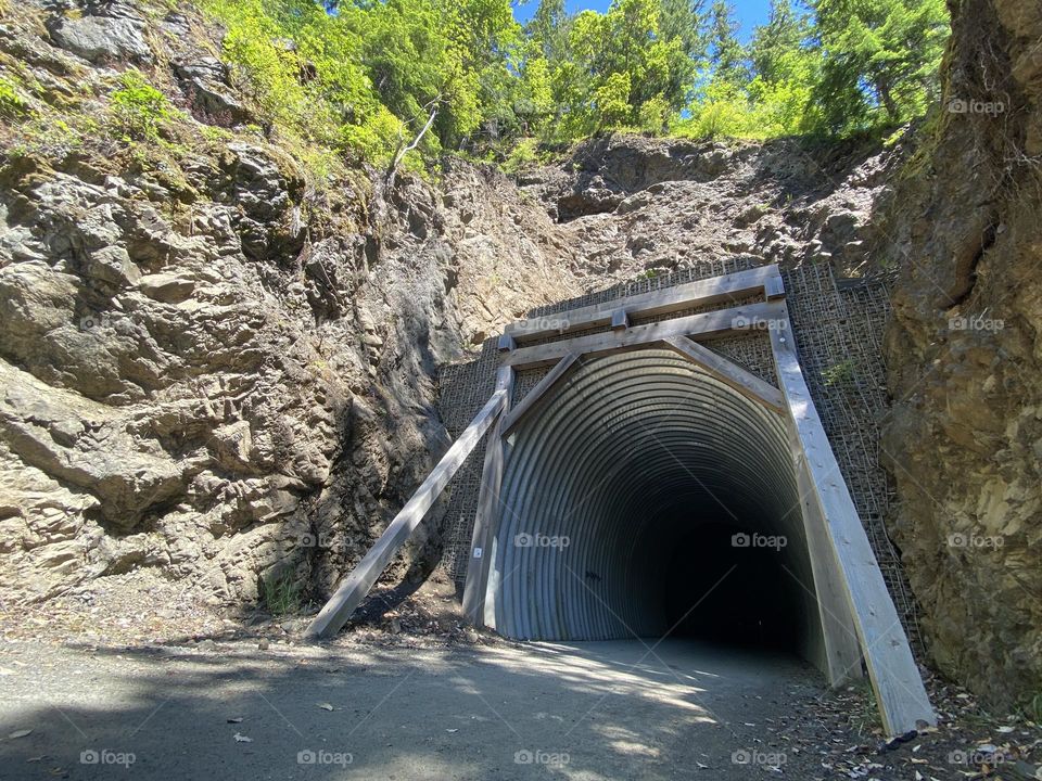 Tunnel through a hill for a walking trail