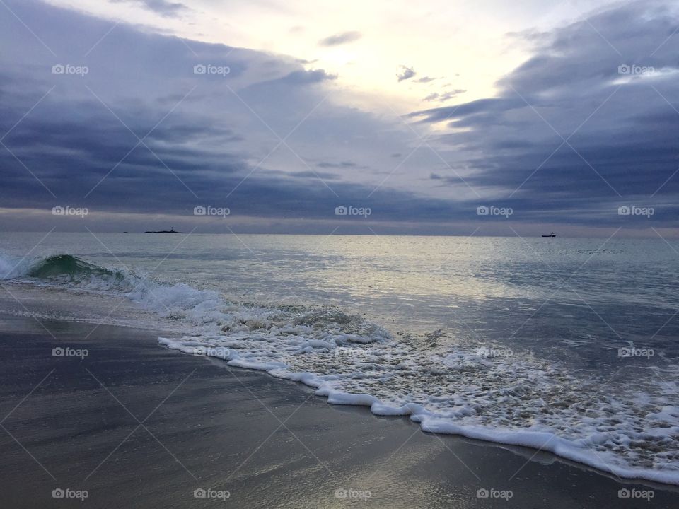 Clouds reflecting on beach