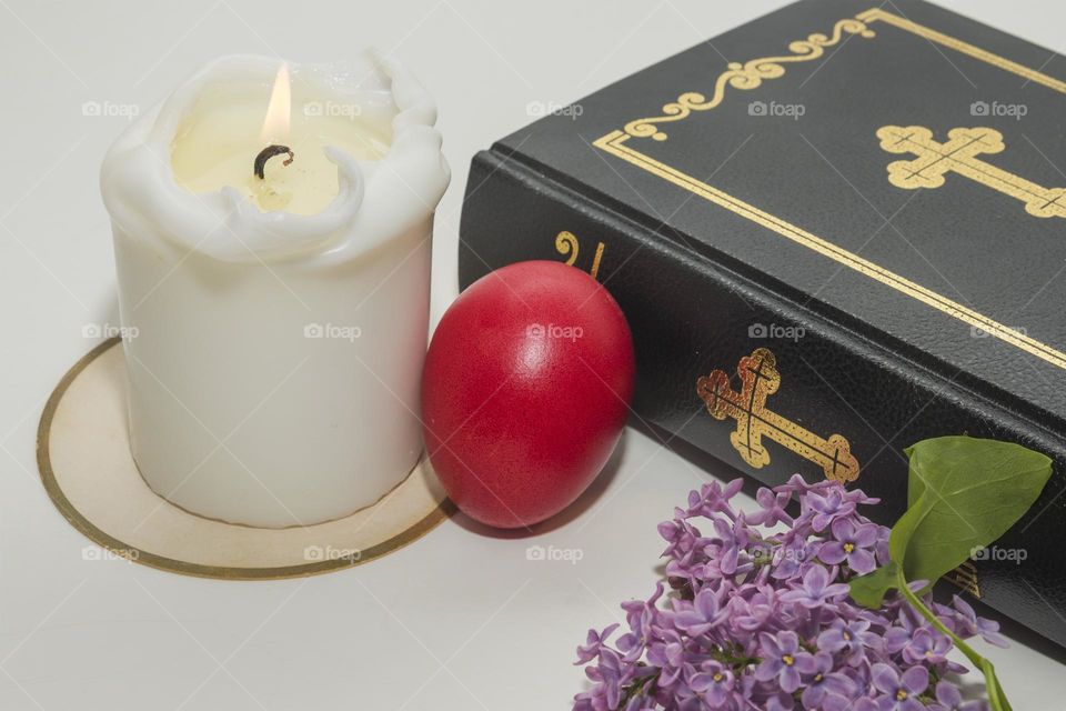 Red egg, candle and bible