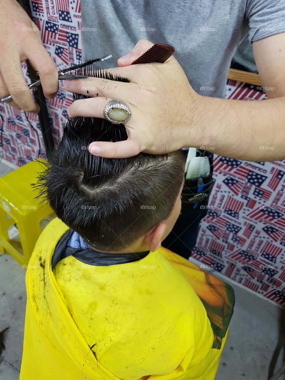 young boy getting a hair cut