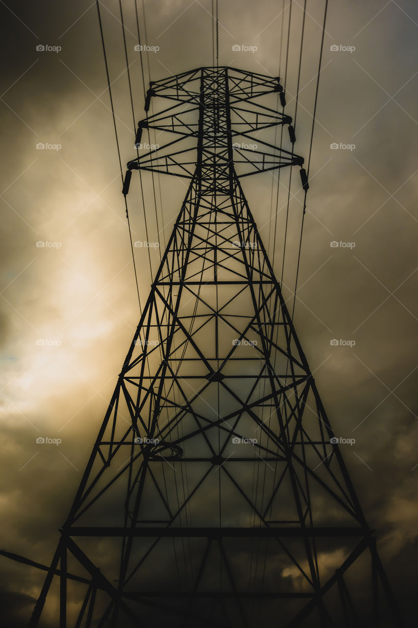 Transmission tower with dramatic sky