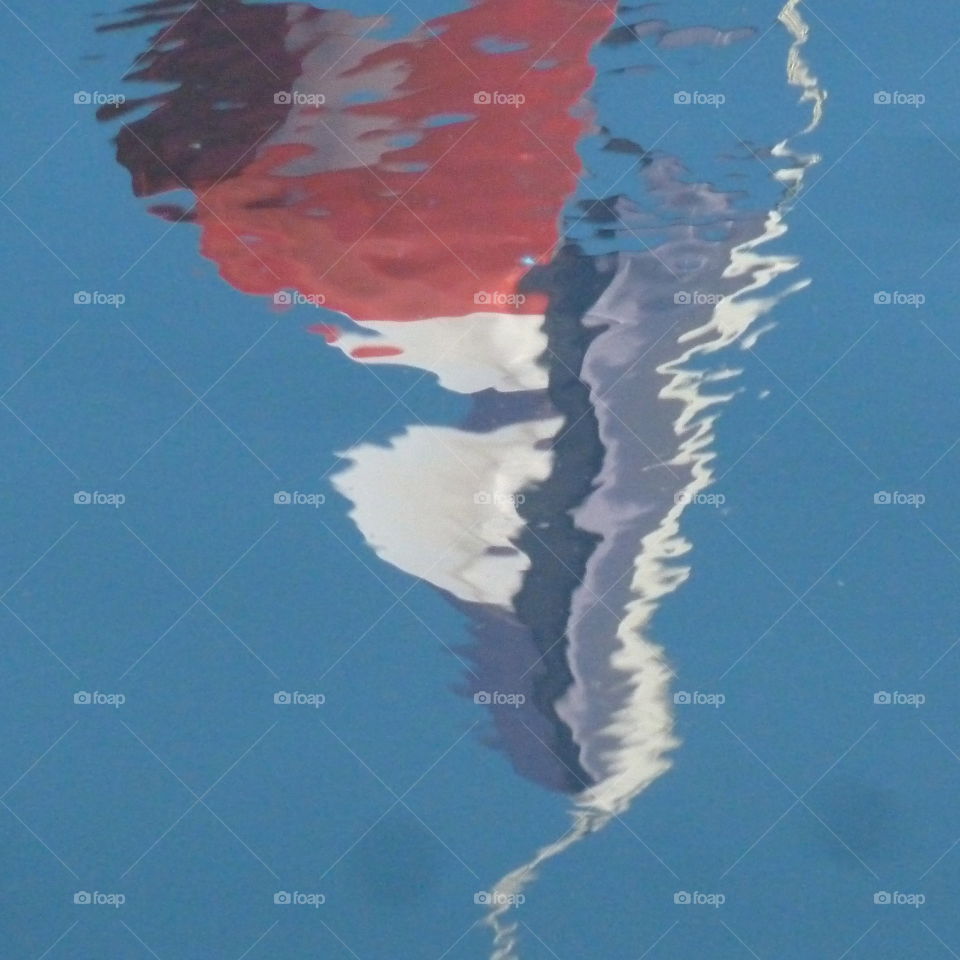 reflection of the french flag in Honfleur