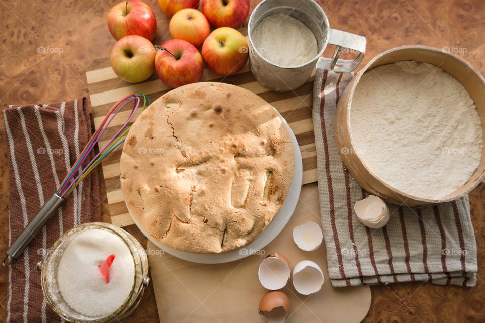 Making homemade puffed apple pie with eggs, sugar and flour.