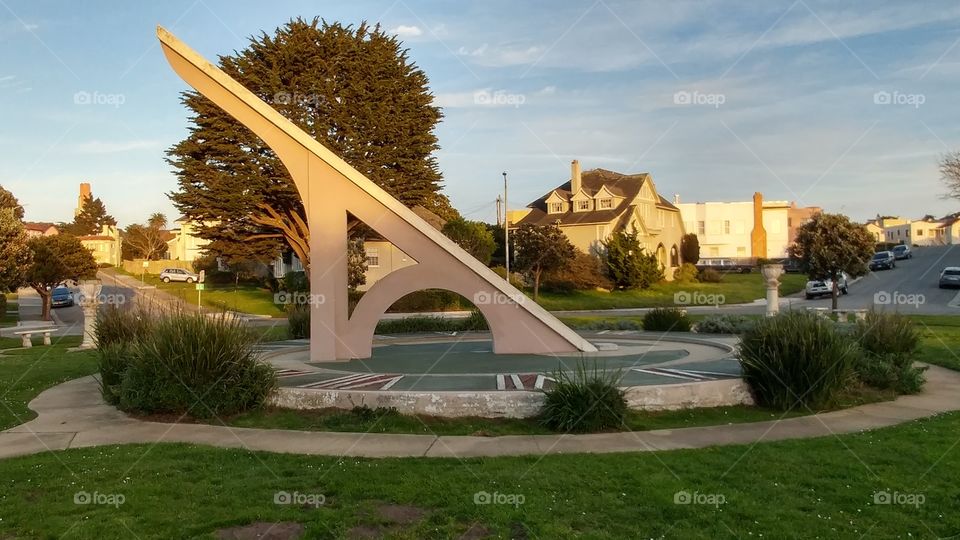 sun dial in the suburbs