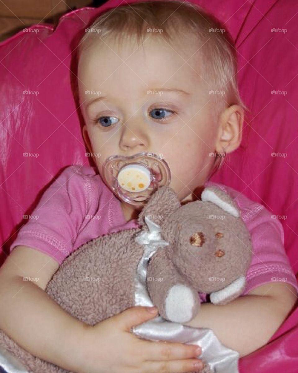 Close-up of a boy holding teddy bear