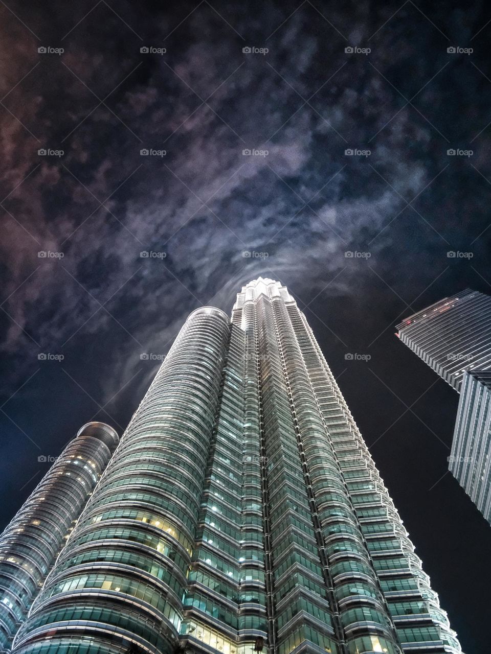 Illuminated clouds at the top of The Petronas Towers in Kuala Lumpur, Malaysia