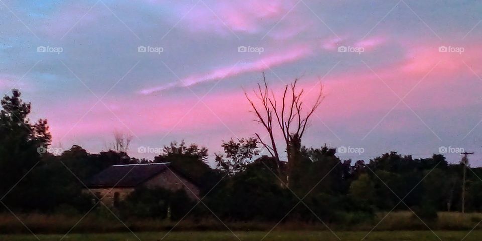 old schoolhouse at sunset