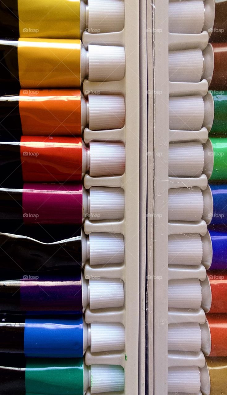 First, the supplies. An overhead still life of colorful oil paints in my workspace 