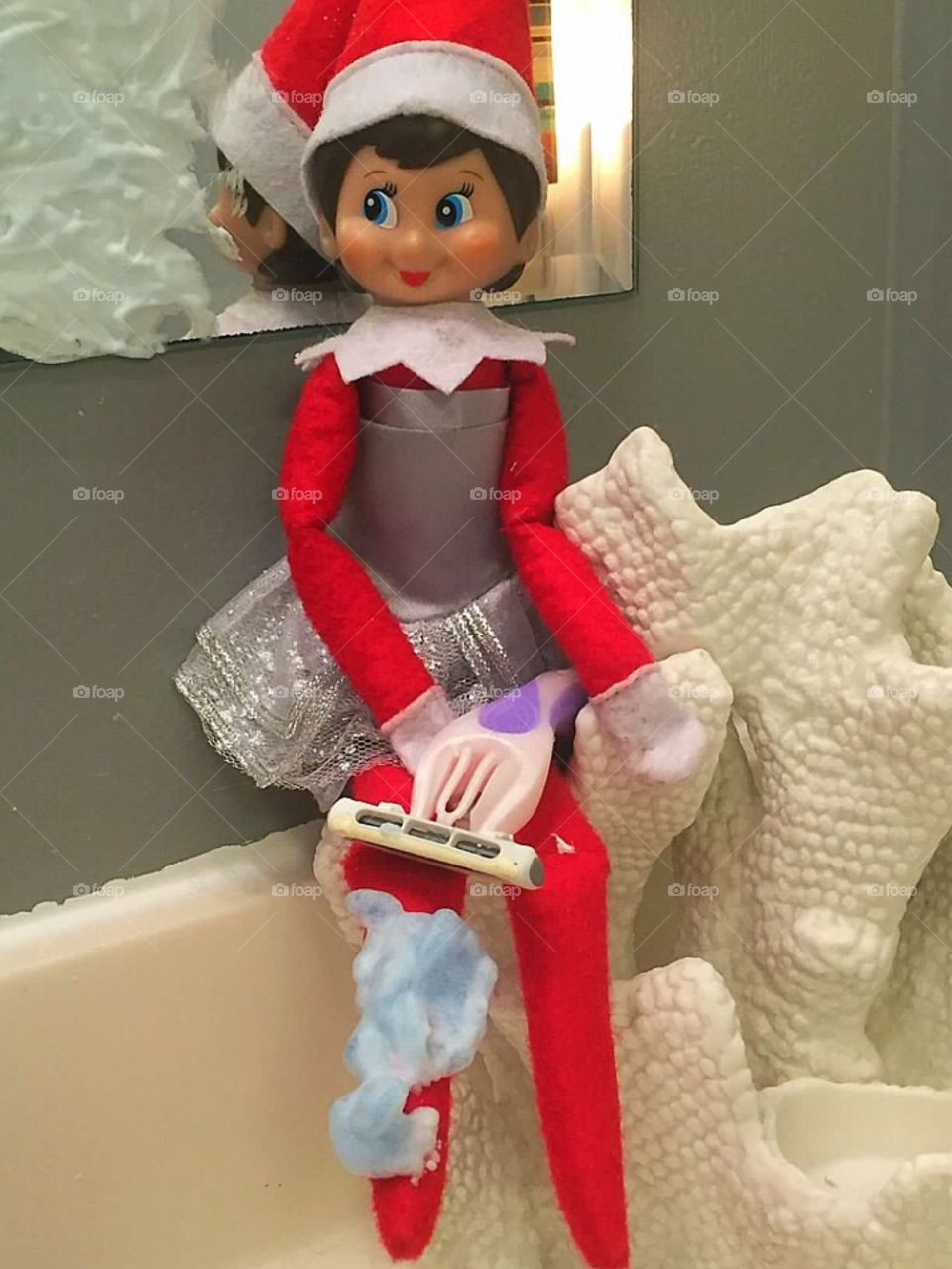 Our girl elf caught shaving her legs. 