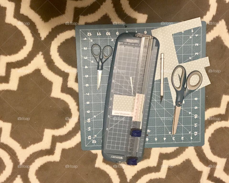 Paper cutting board with measuring cutting board, scissors and paper to create fun arts and crafting projects 