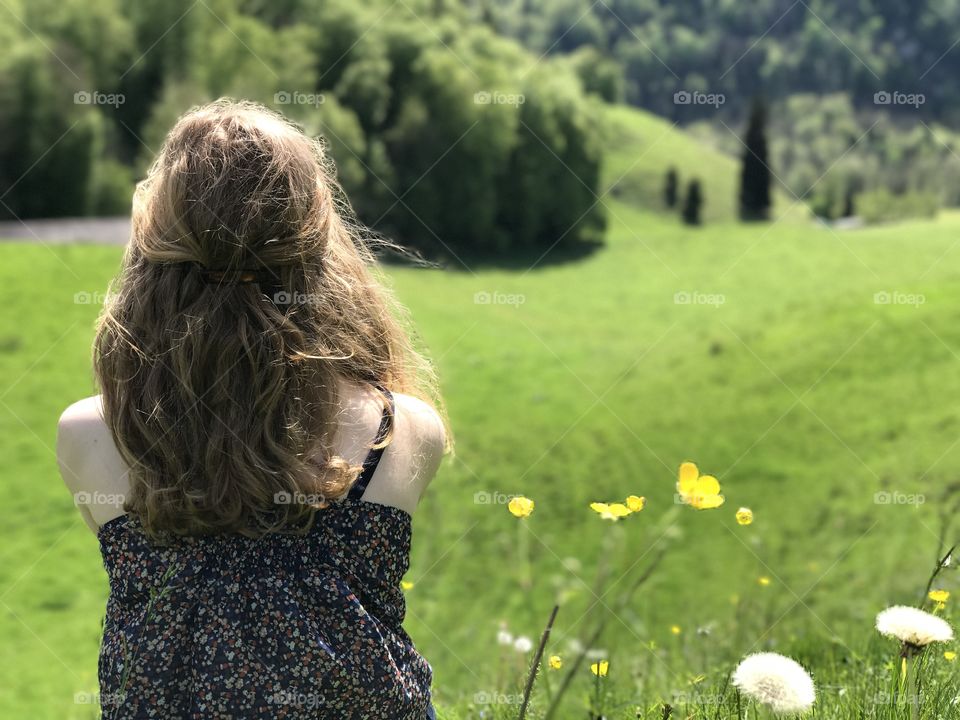 Young woman looking into the distance in Gruyere, Switzerland. 