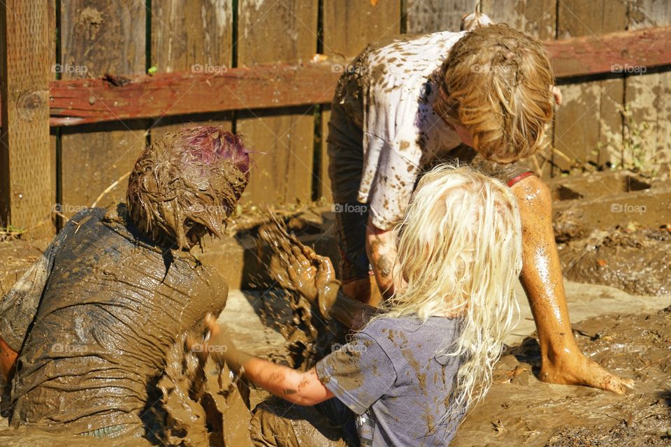 Boys Playing In The Mud