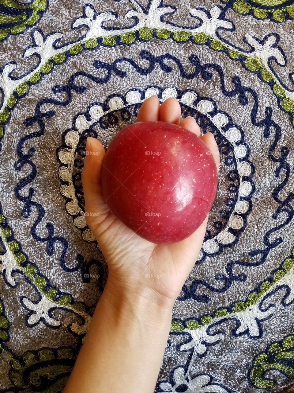 Holding an apple