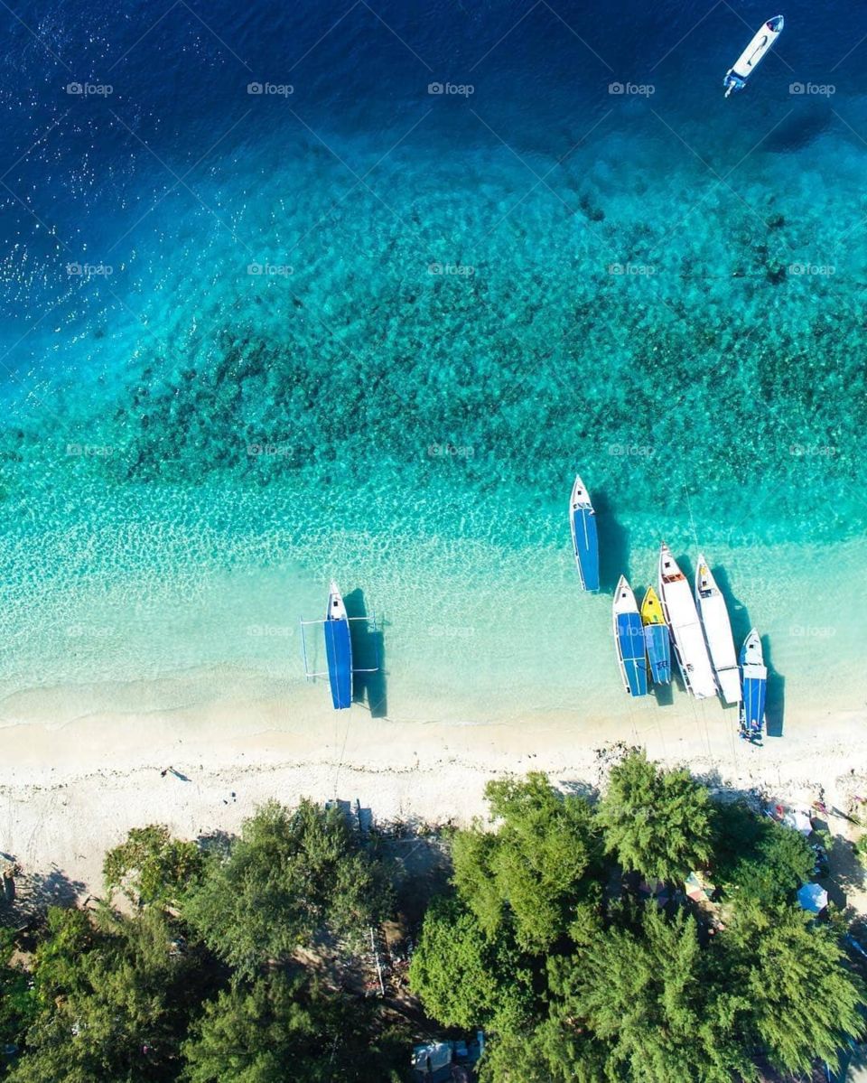 Blue ocean and boat stand in gili island