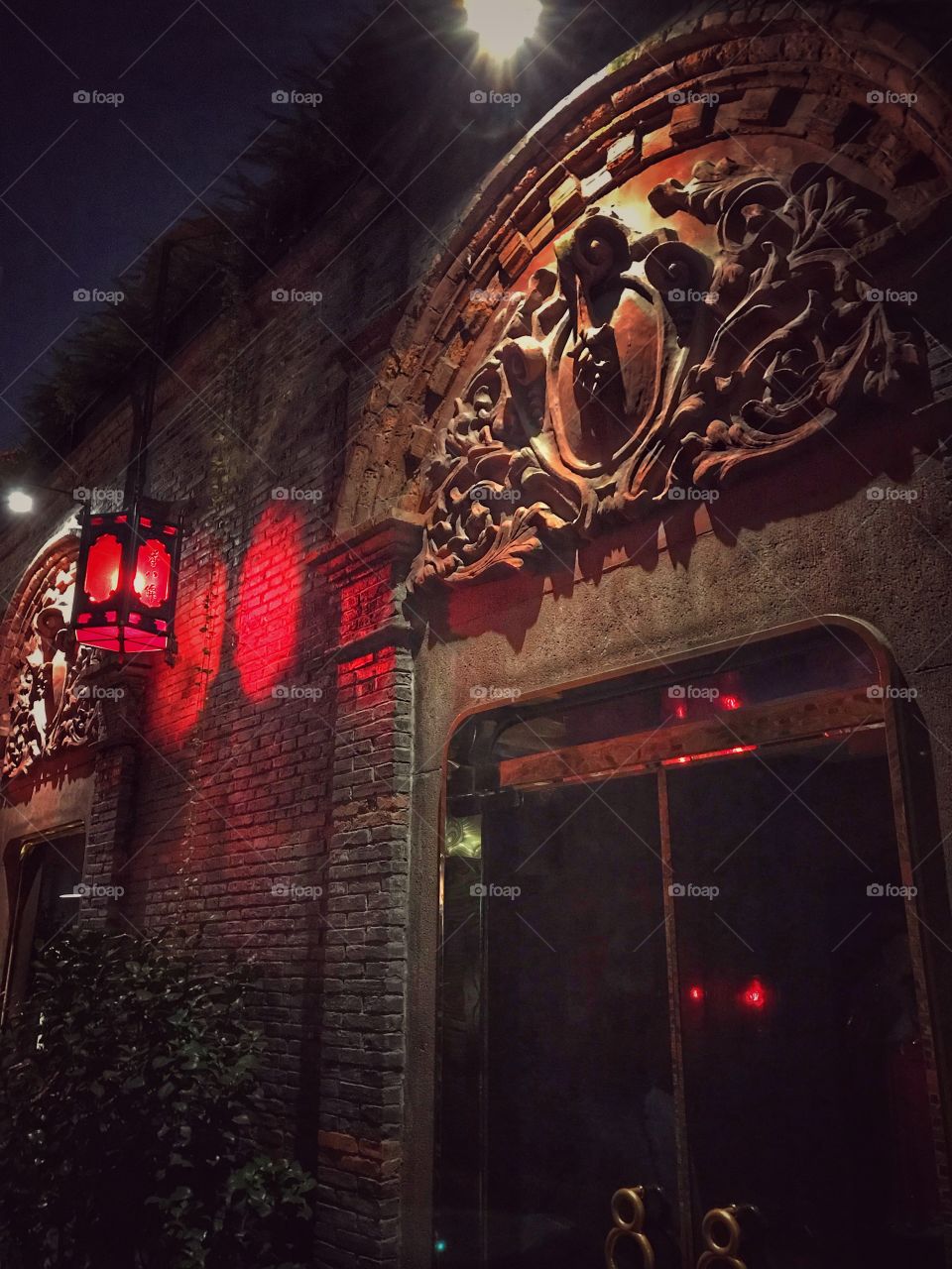 Red lantern and a restaurant door - combining the artsy and neat into an interesting environment at Xintiandi 