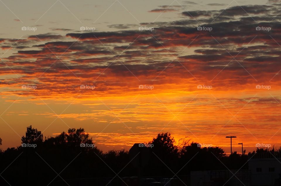 Sunset turns the sky orange