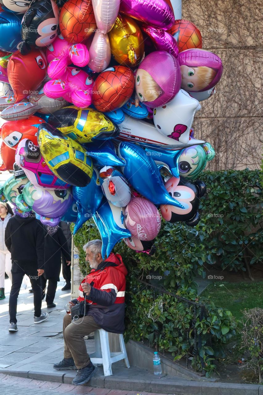 Flying balloons and dealer with various colours and figures