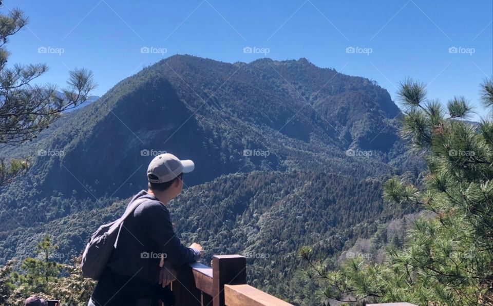 Staring at the scenic mountain.