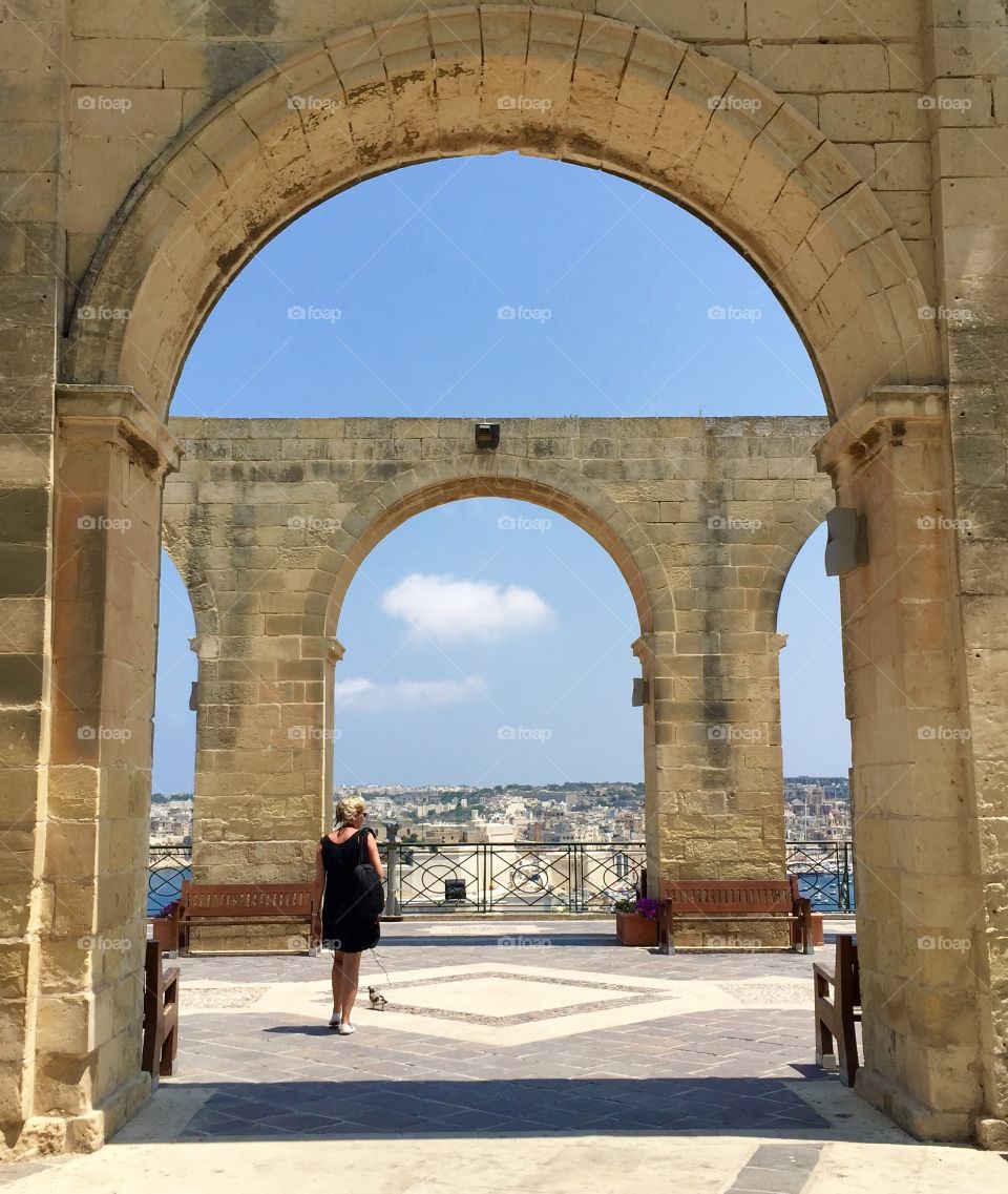 Beautiful archway in Valetta, the capital city of Malta! The double arch is striking in this photo and the beige stone walls work perfectly with the clear blue sky to create a visually conflictive image! 