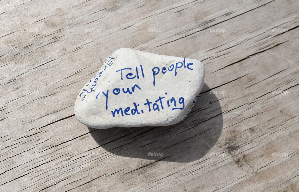 Stone with an affirmation written on it