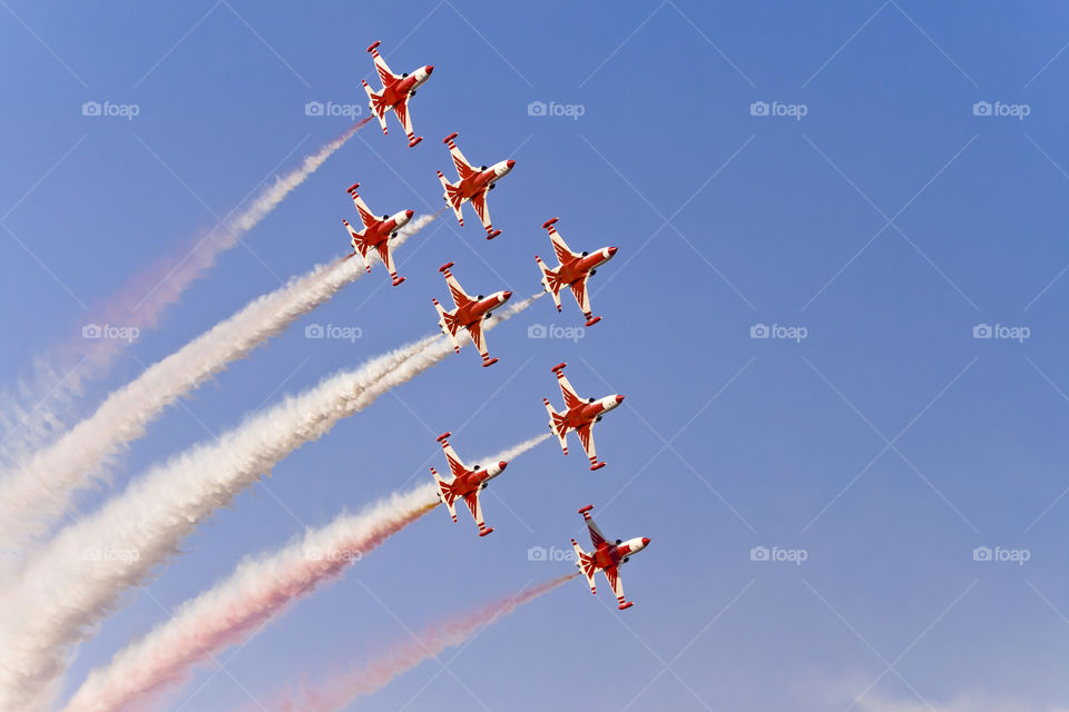 Aerobatic planes team in the sky
