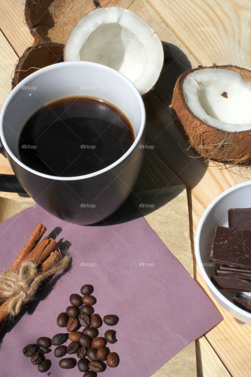 Coffee, hot drink, drink, grain, coffee beans, cinnamon, sticks cinnamon, lilac, flowers, purple flowers, bouquet, flowers in a vase, vase, coconut, chocolate, rest, morning, work, cafe, restaurant