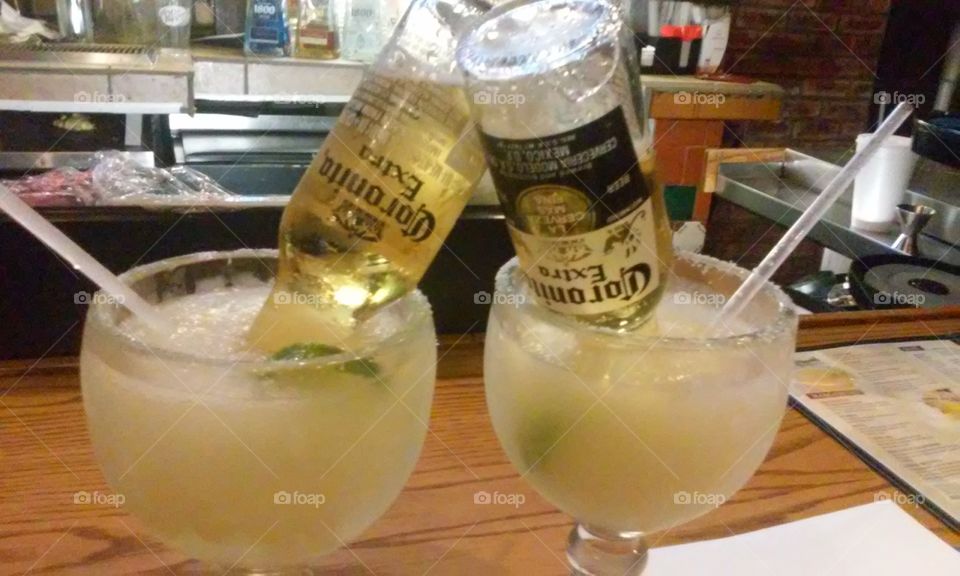 Our favorite summer beverage...Corona Rita's. Frozen lime margarita with a bottle of Corona Extra beer.Delicious!!